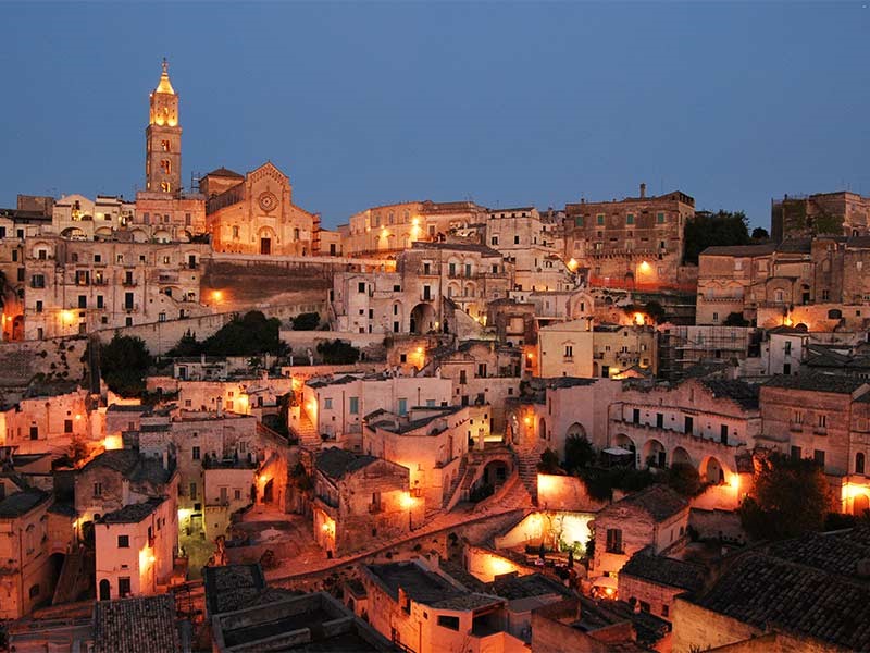 Matera at sunset, ancient town near our villas in Puglia | Essential Italy