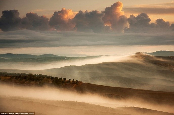 Hills of Tuscany shrouded in mist photos Puglia luxury apartments Essential Italy