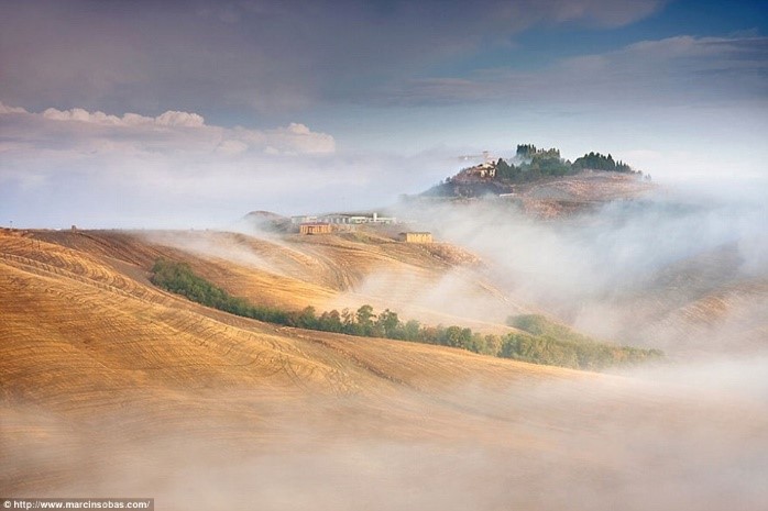 Hills of Tuscany shrouded in mist photos Puglia luxury apartments Essential Italy