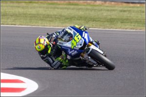 Valentino Rossi cornering with sparks flying from elbow – Essential Italy Tuscany Villas