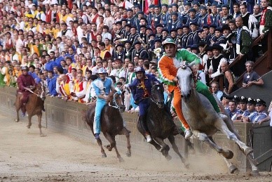 Il Palio Siena horse race taking place near our villas in Tuscany Italy