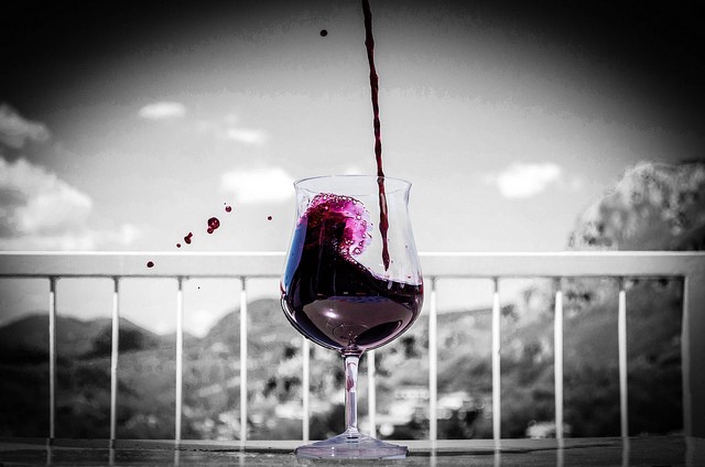 Wine being poured during a stay at our villas in Puglia