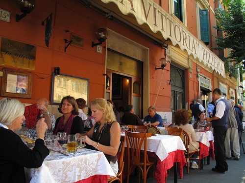 Dining out in Italy at a trattoria restaurant on your luxury holidays