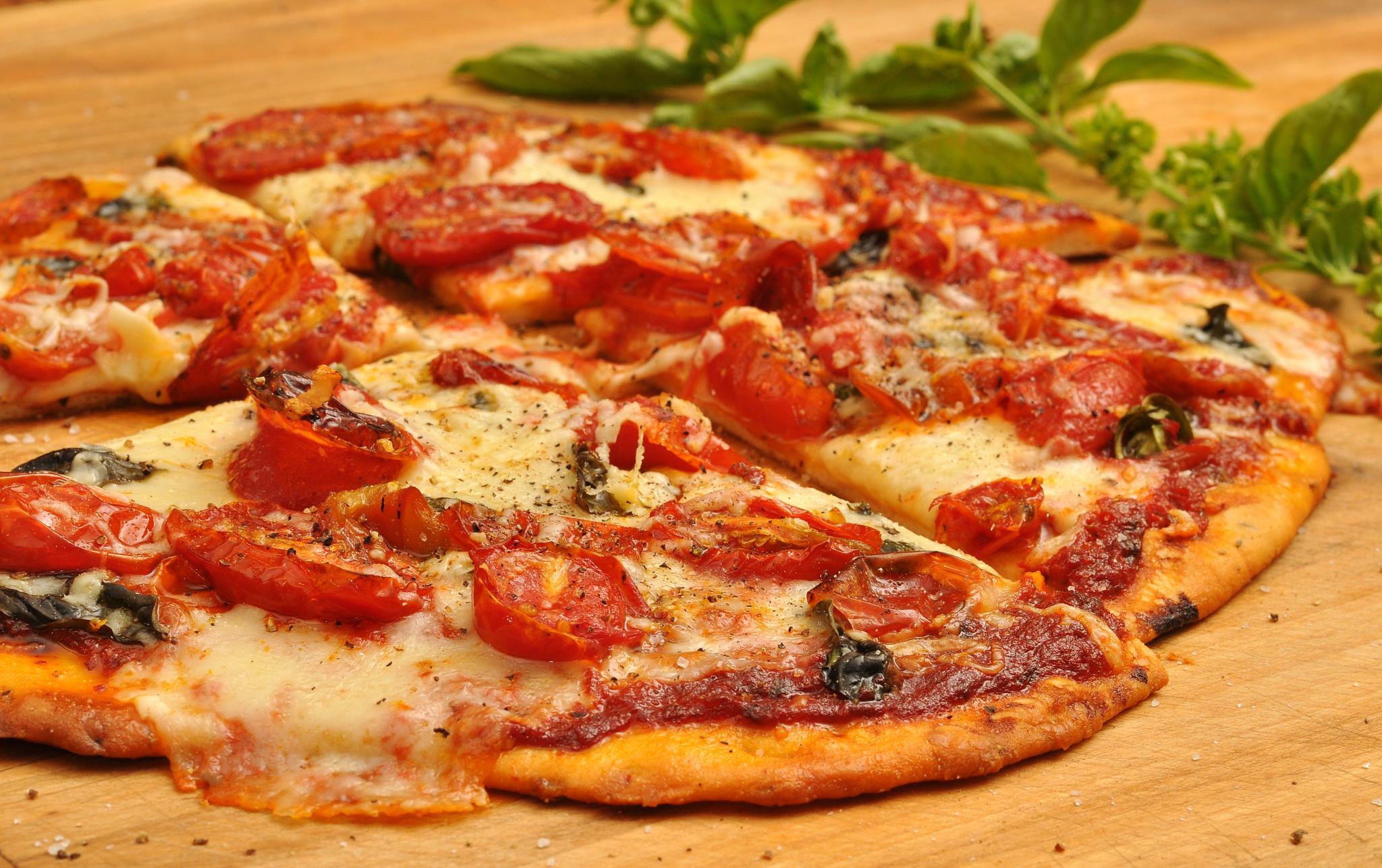 An Italian pizza with tomatoes