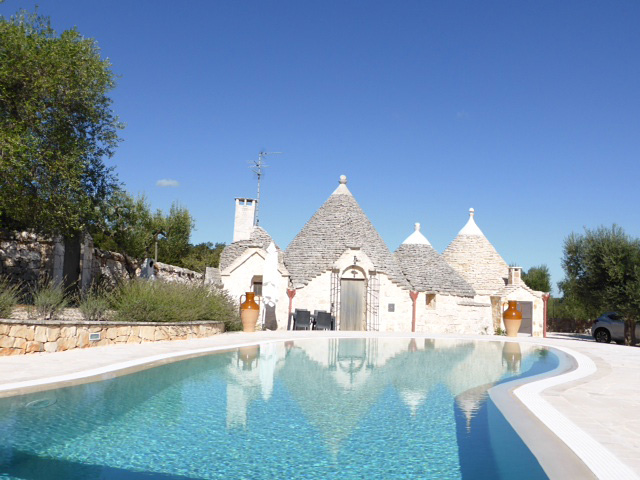 Trullo bianco villa in Puglia with a pool.