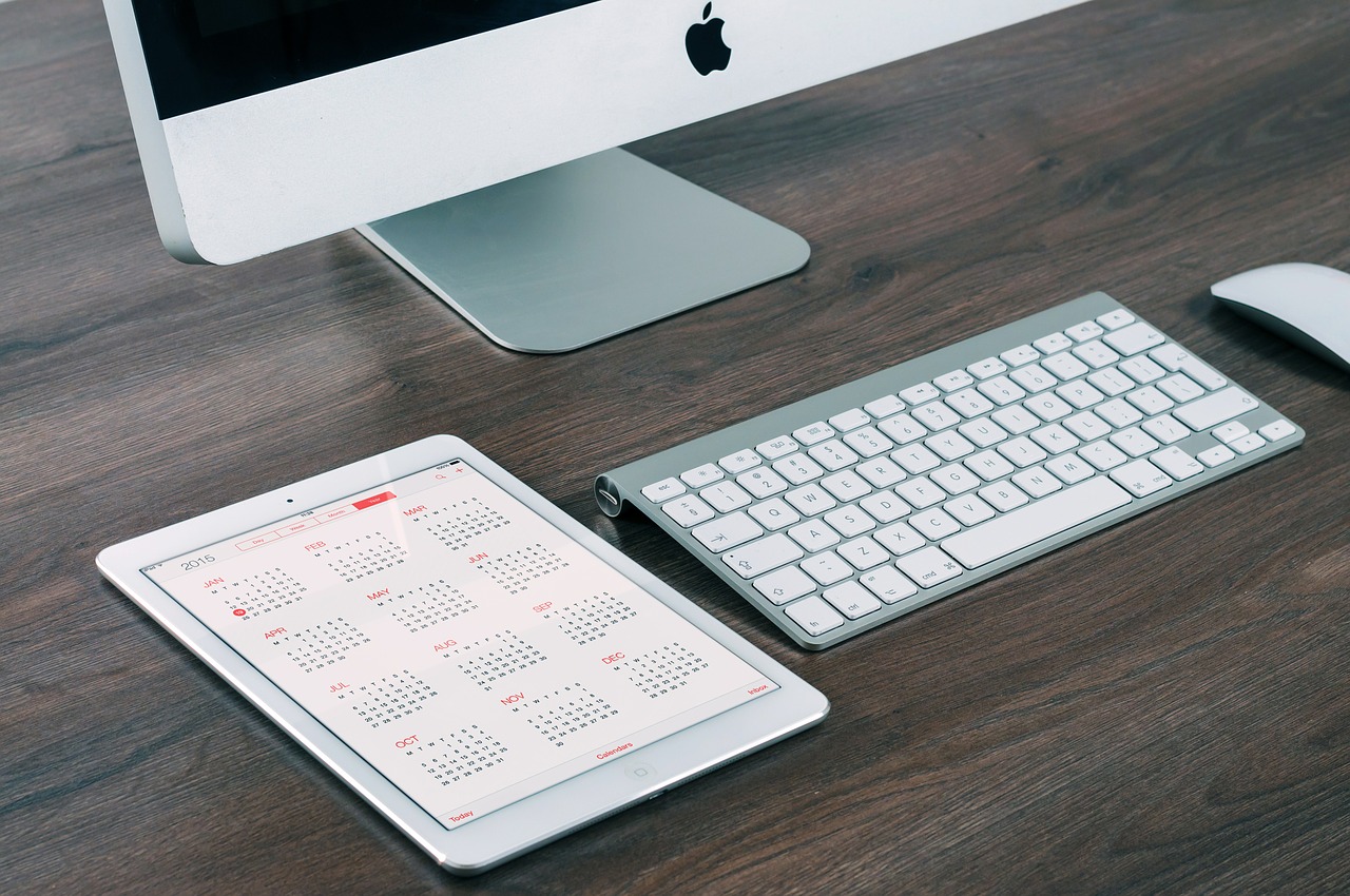 An iPad and iMac on a desk