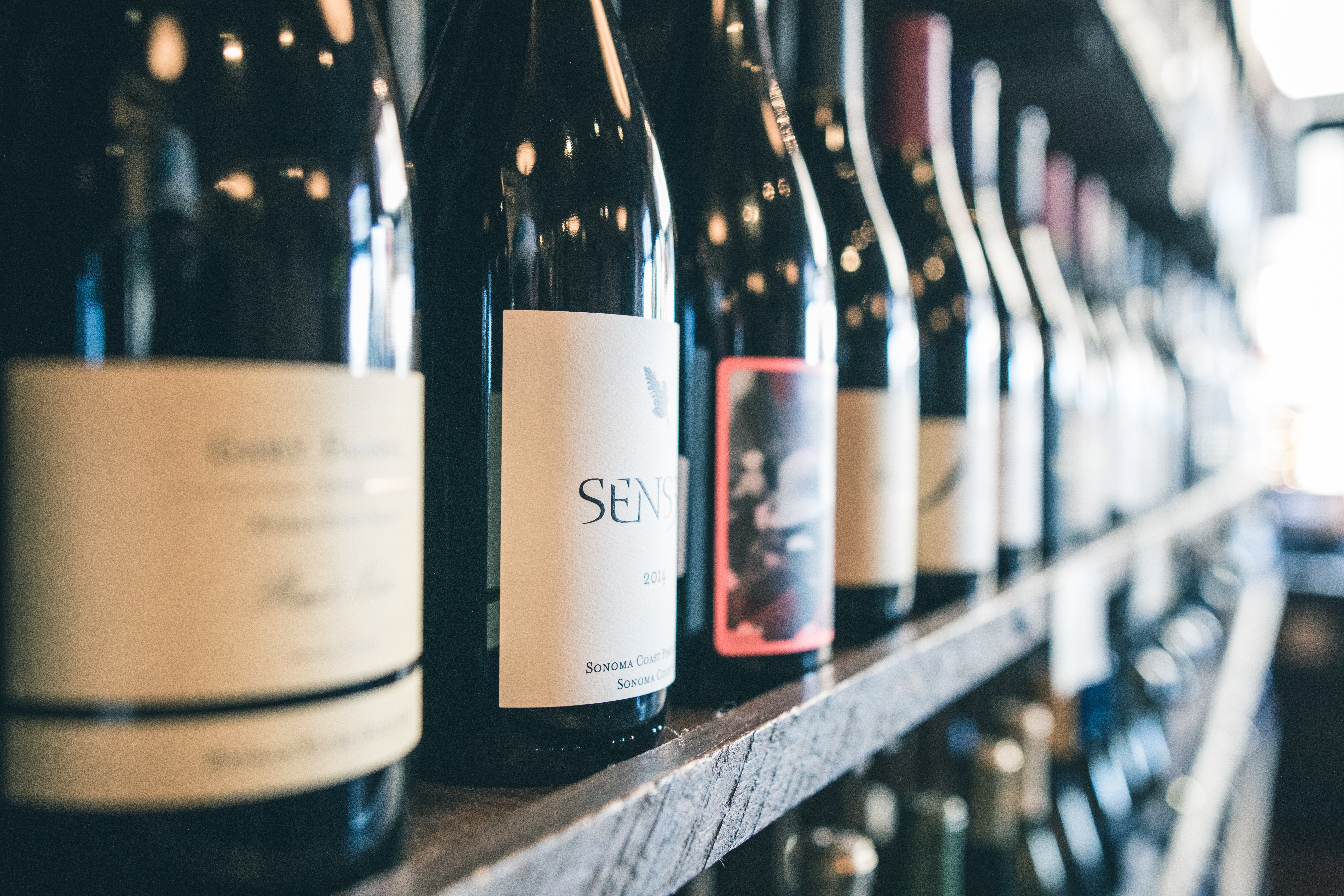 A selection of Italian wines on a shelf