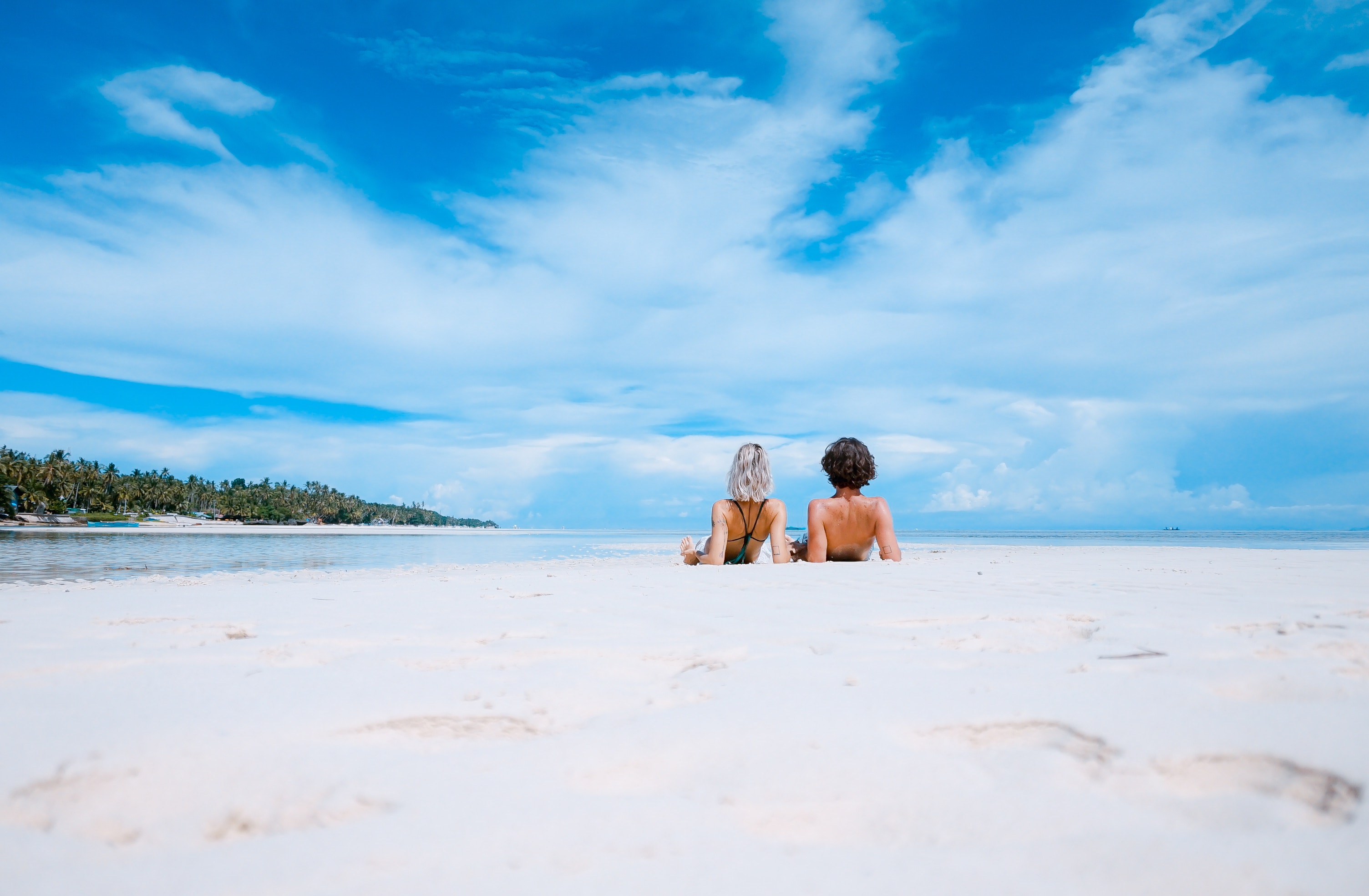 A couple enjoying a sandy Italian beach