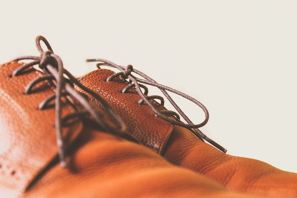 A close up of a man’s pair of tan shoes.