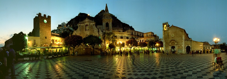 A panoramic shot of the plaza in Taormina, Sicily, at night