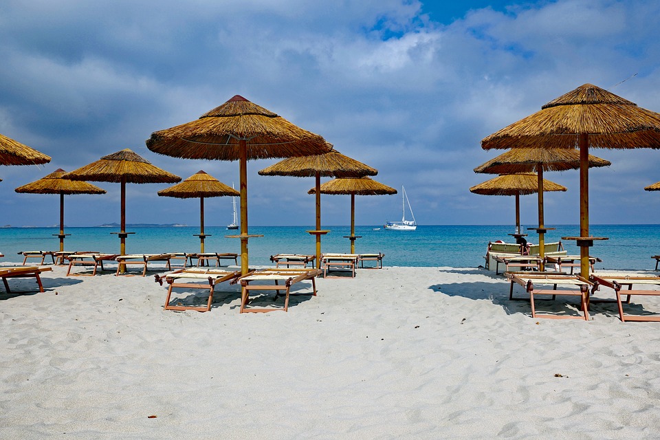 Parasols and sun-loungers on a beach in Sardinia