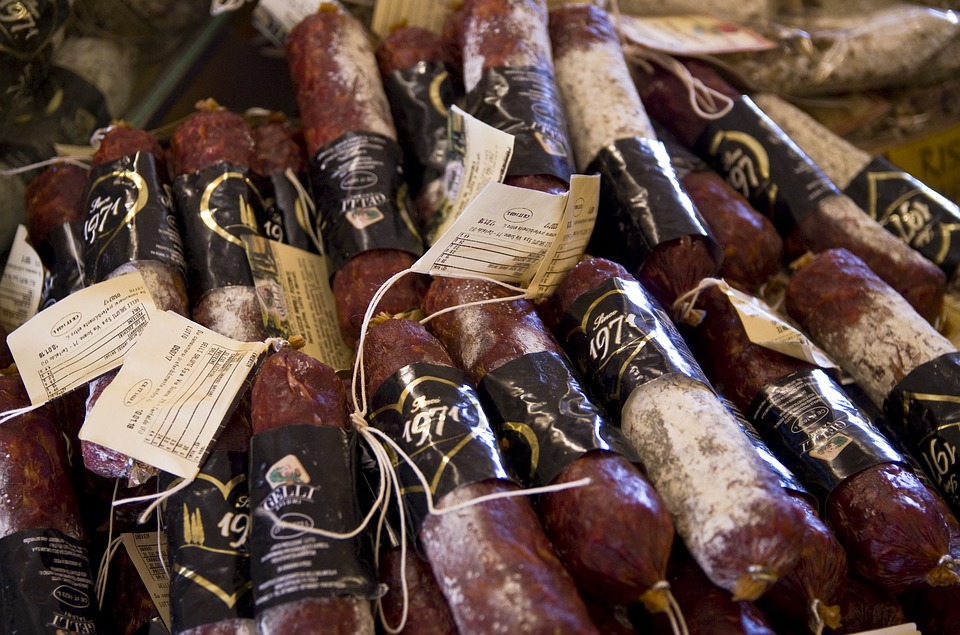 Rolls of salami being sold in Tuscany