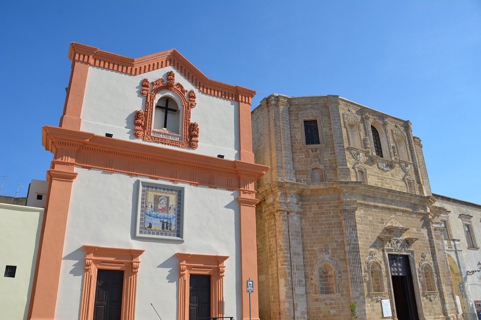 Colourful religious buildings in Gallipoli, Puglia during summer