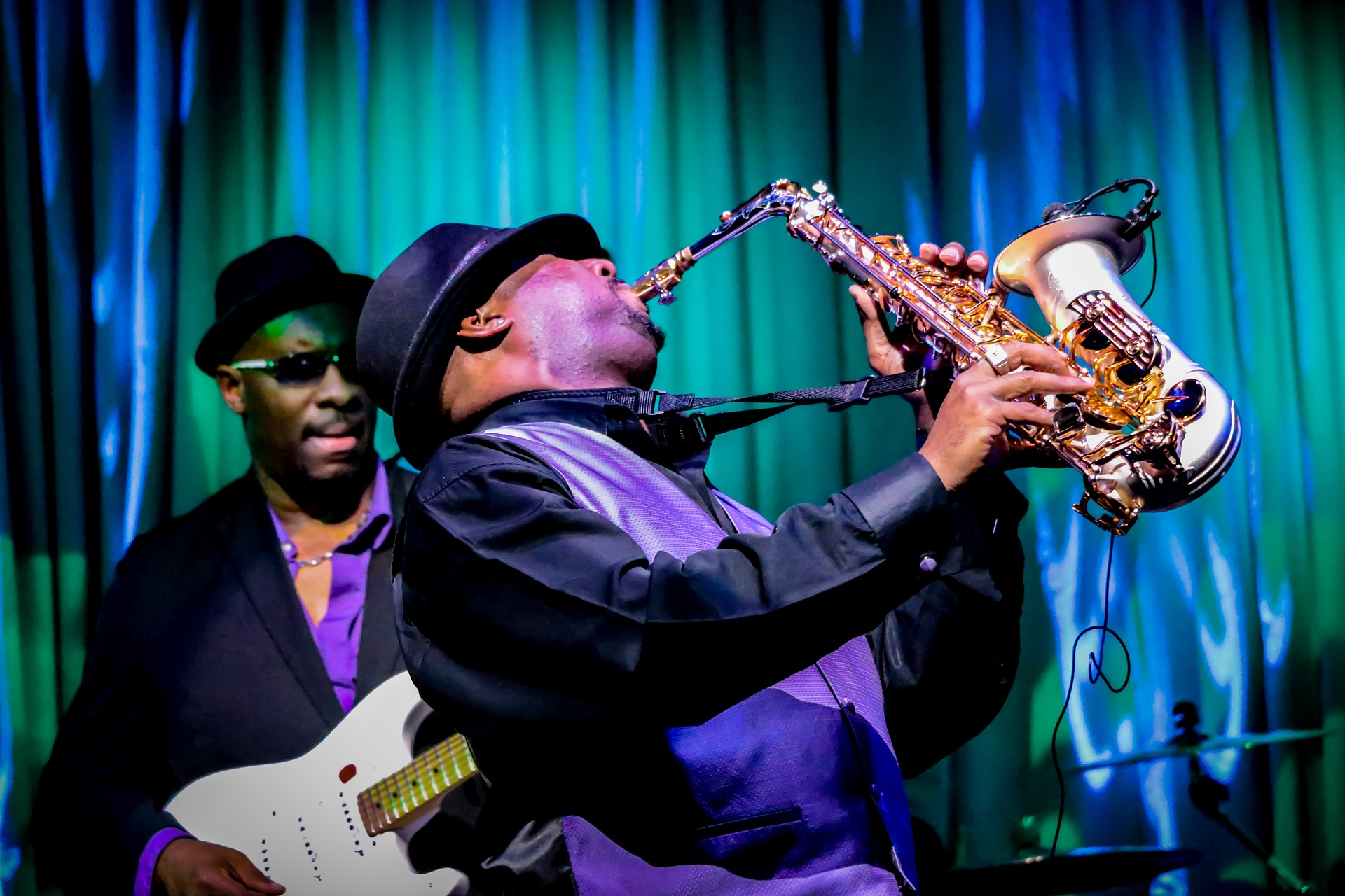 Man playing music on a saxophone 