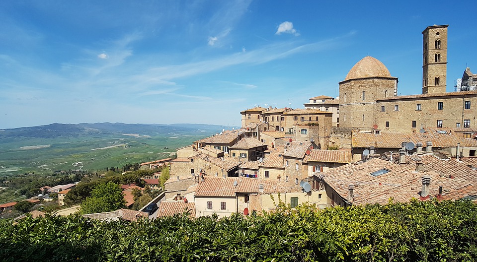 The town of Volterra in Tuscany on a sunny day with a view of the countryside