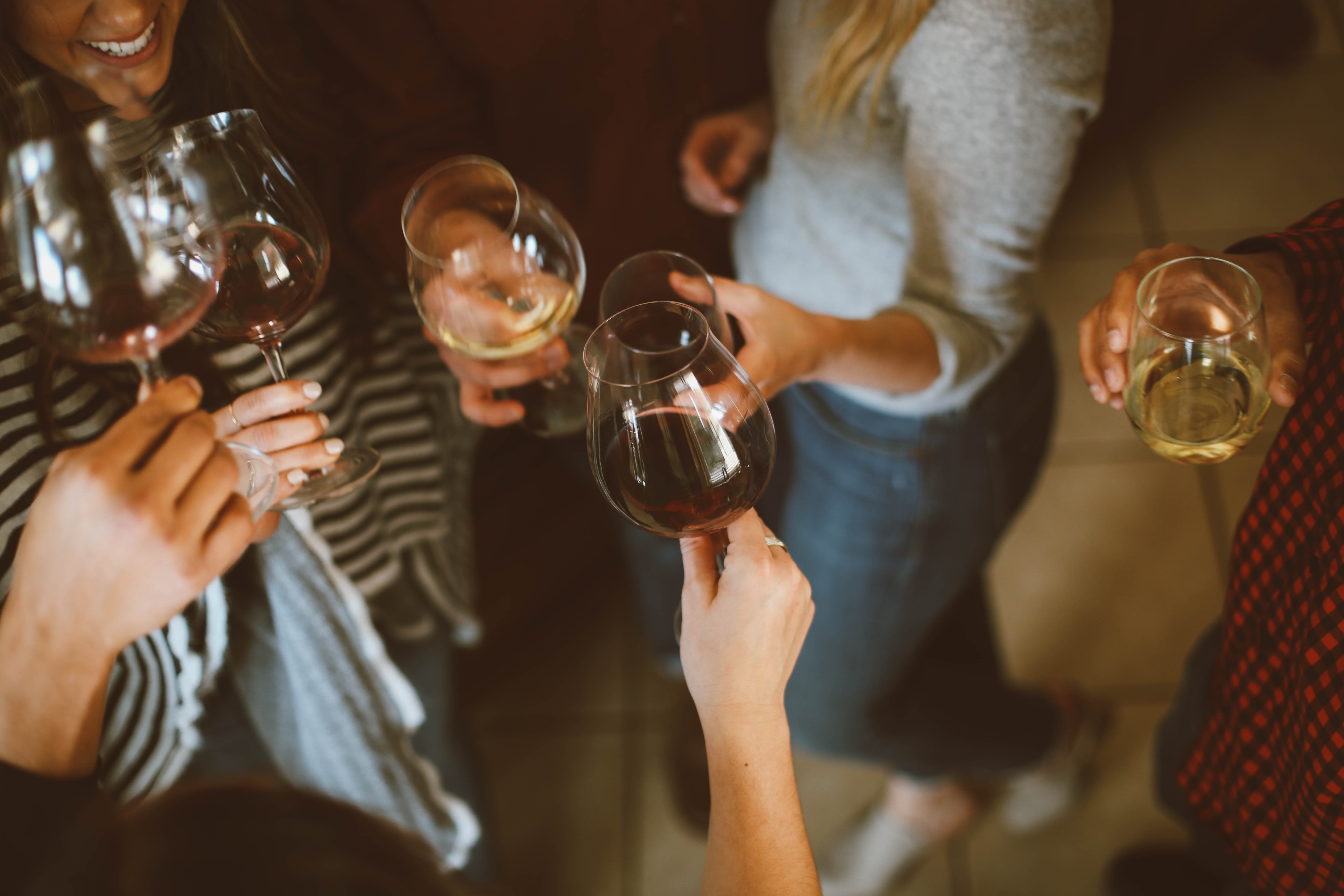 a group of people enjoying glasses of wine