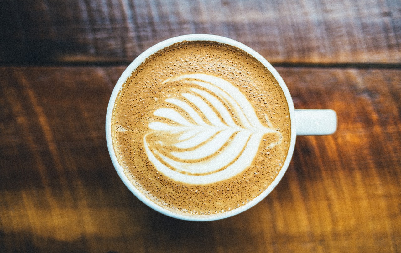 Cup of coffee on wooden table.