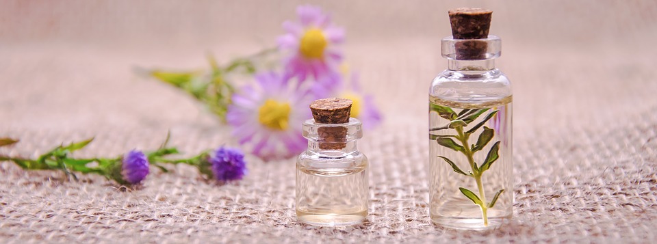 botanical perfume bottles and flowers